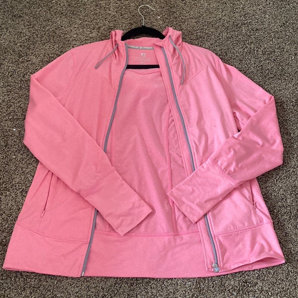 Pink activewear jacket with hoodie zip up hoodie.